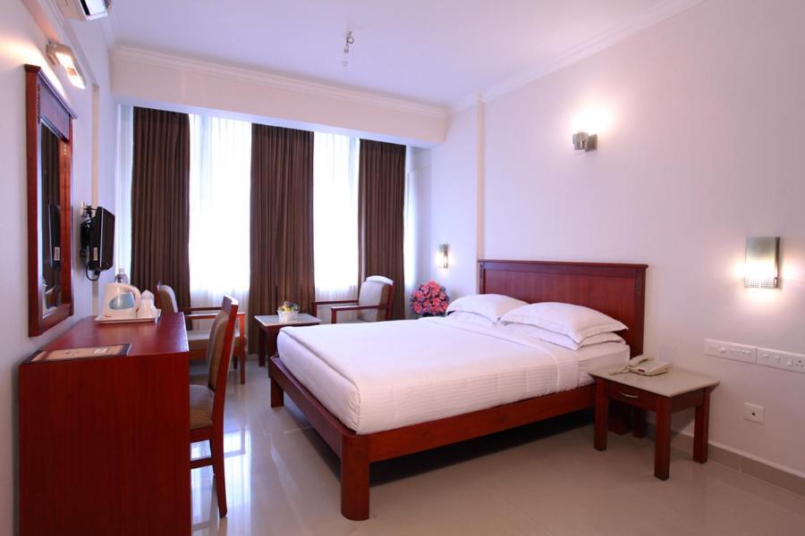 Pooram International Hotell Thrissur Rum bild